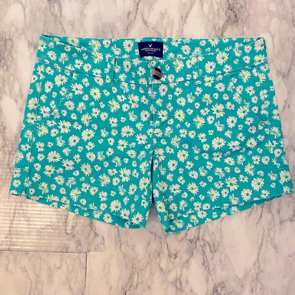 Greenish/blue with yellow and white flowers. Stretch midi shorts